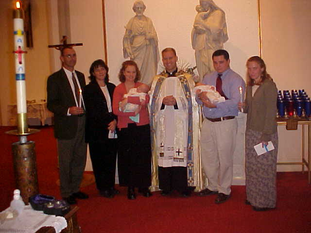 Godparents at baptism 300 pixels